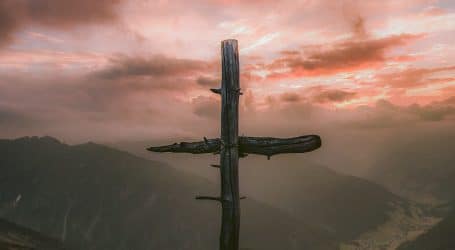 grey wooden cross on mountain