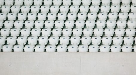 white seats with gray concrete platform