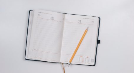 pencil on opened notebook