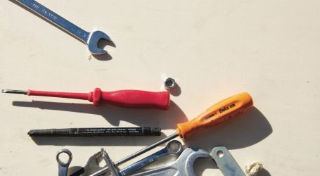 red and silver hand tool