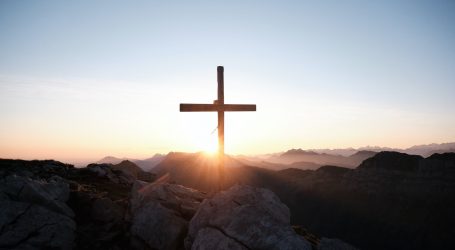 brown cross on brown rock during daytime