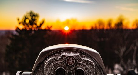 selective focus photo of silver tower viewer telescope facing sunshine