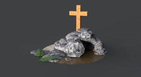 gray stone cross on brown wooden round table