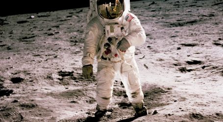 astronaut standing on gray sand