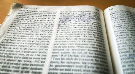 a close up of an open book on a table
