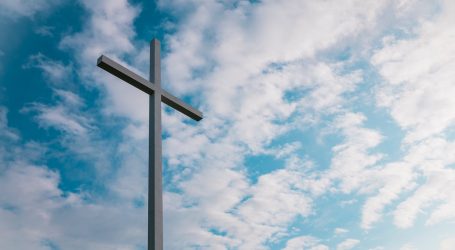 landscape shot of white cross during daytime