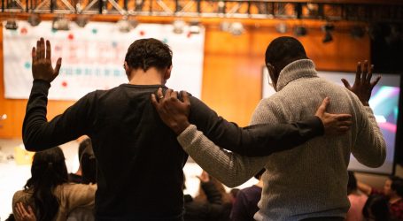two men holding each others hand