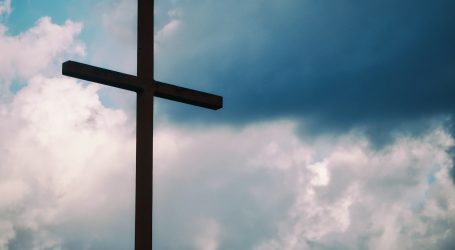 black cross under blue sky
