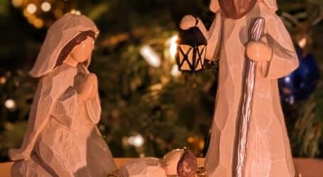 a nativity scene of a manger scene with a baby jesus in a man