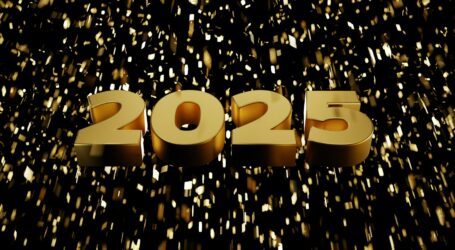 A golden new year date sign on a black background