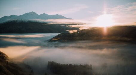 bird's eye-view photography of mountain surrounded with fog